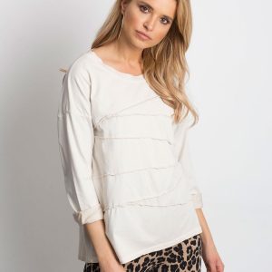 Wholesale Light beige blouse with asymmetrical stitching